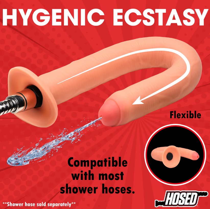 A flexible, peach-colored silicone enema hose attachment connected to a shower hose, spraying water.