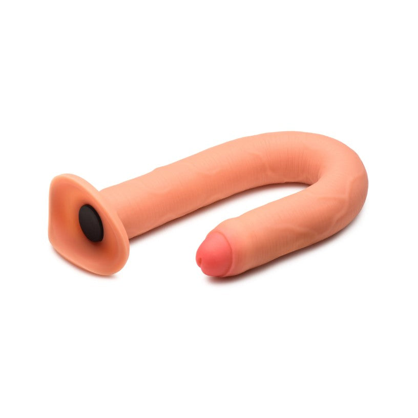 A curved, peach-colored silicone enema hose attachment with a flared base.