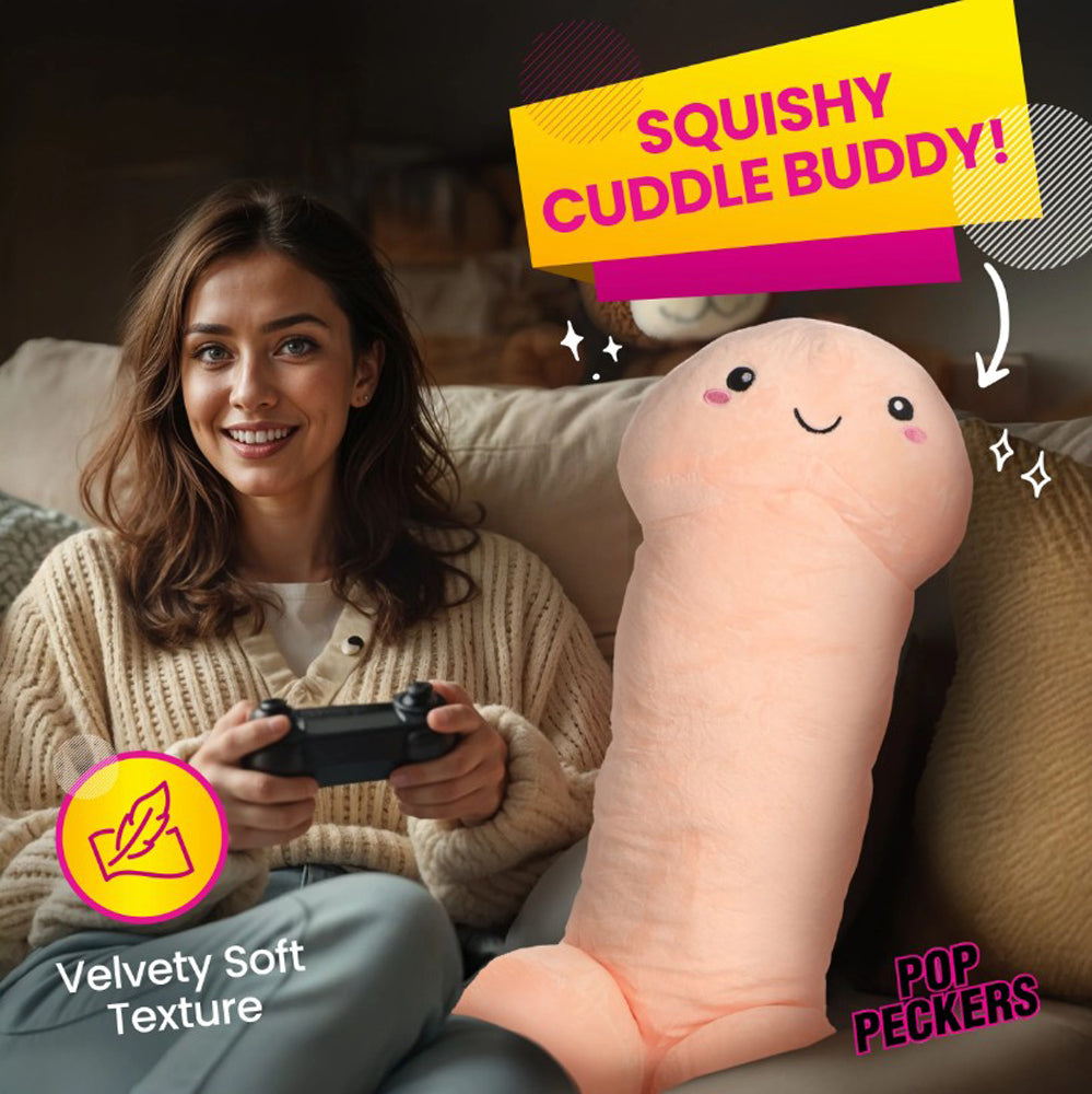 A large, light-peach plush penis pillow with a happy face.