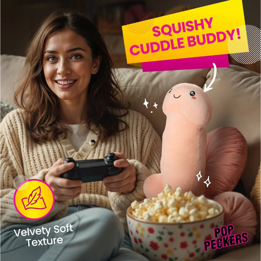 A woman holds a video game controller while a plush penis pillow sits next to a bowl of popcorn.