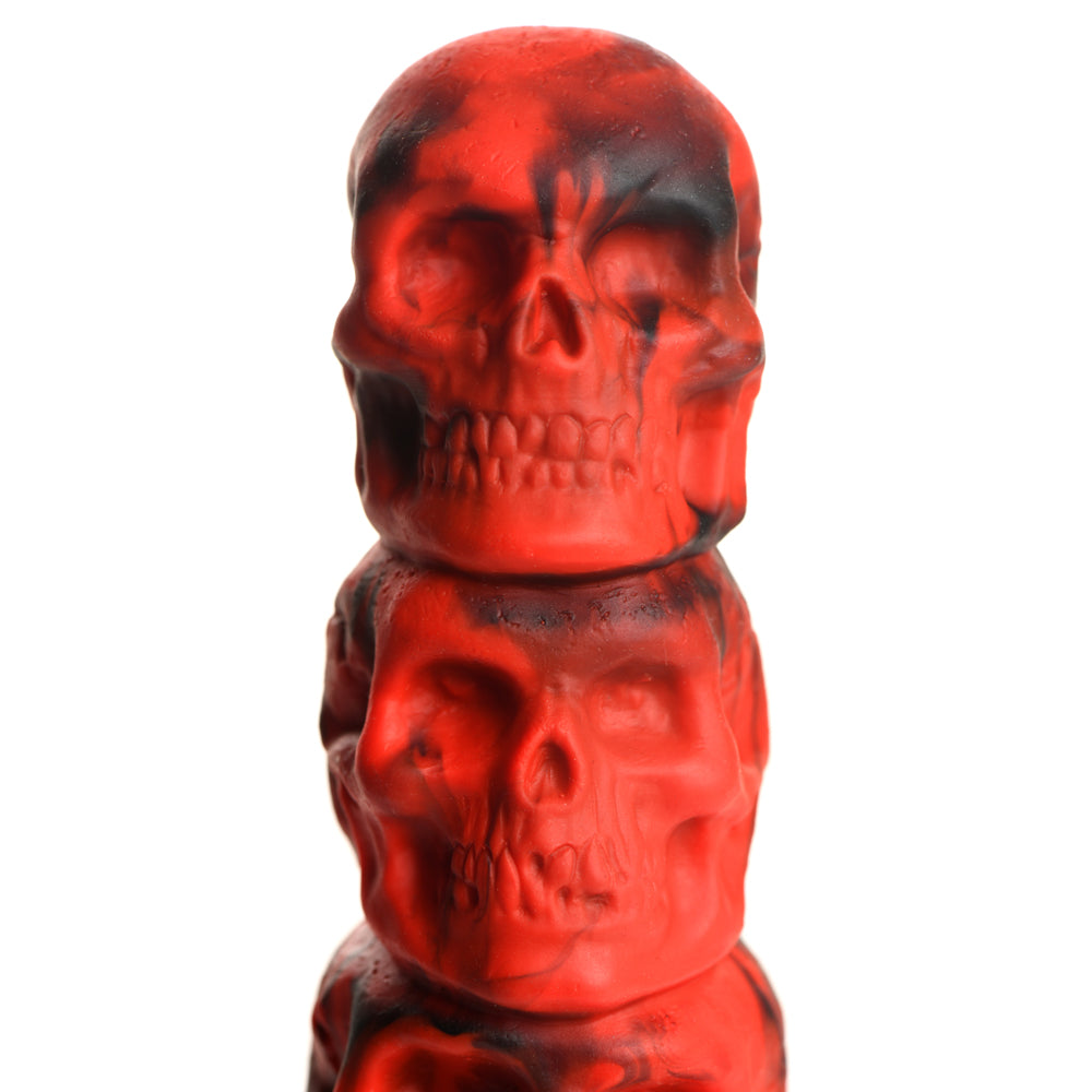 Red silicone dildo stacked with four skull designs.