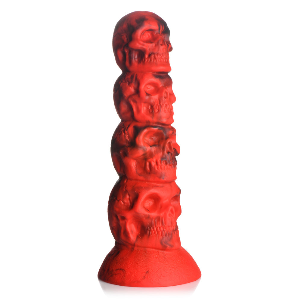 Red silicone dildo with a tower of four skulls and a suction cup base.