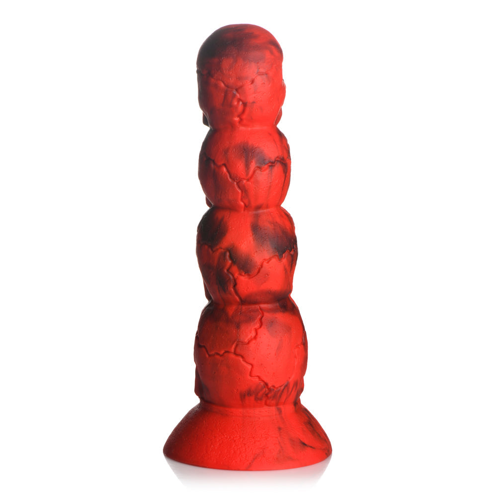 Red silicone dildo shaped like a tower of four skulls with a suction cup base.