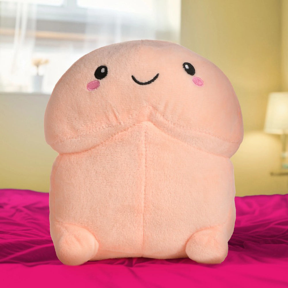 A soft, peach-colored plush toy with a smiling face and rosy cheeks.