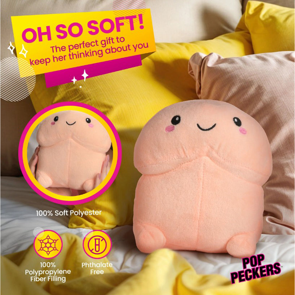 A soft, peach-colored plush pillow shaped like a smiling pecker.