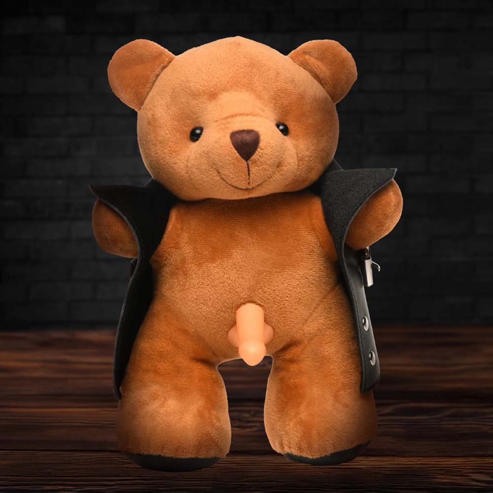 Brown teddy bear wearing a black jacket with a visible phallic attachment.