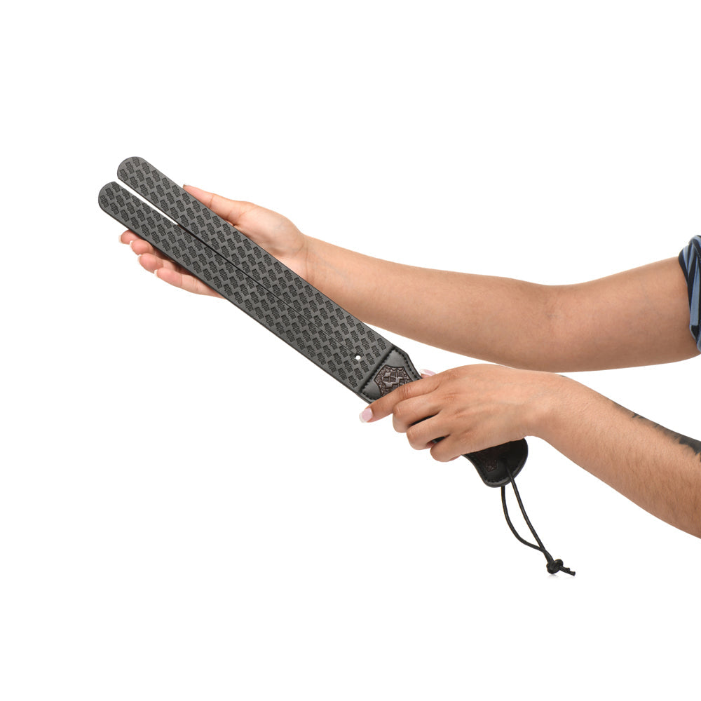 Vegan leather split-tongue discipline whip with a textured surface.