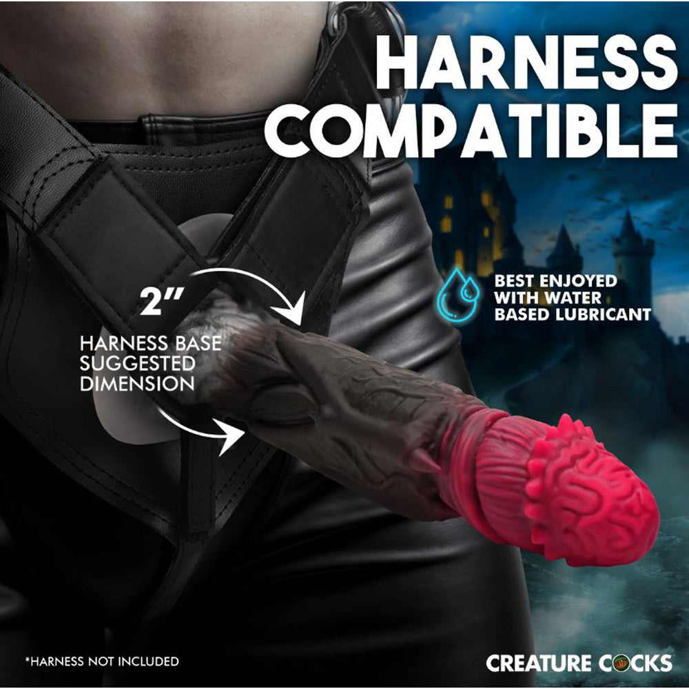 Fantasy silicone dildo with brain-like head and bat wings.