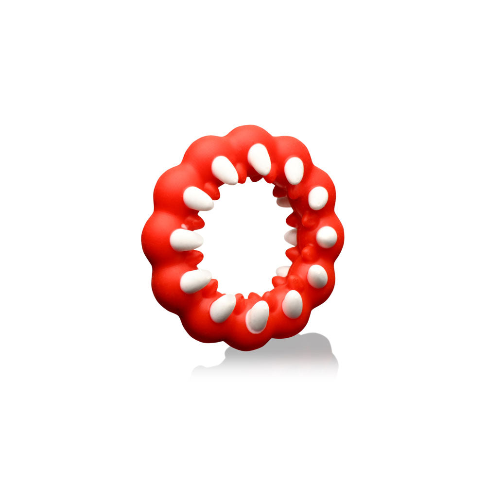 Red silicone cock ring with white fangs and textured bumps.