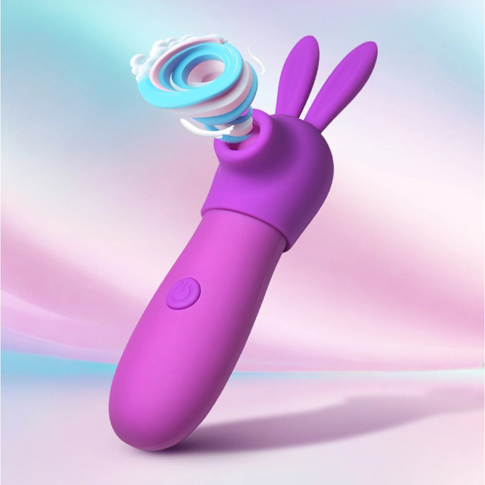 Purple bunny-shaped clitoral stimulator with swirling pink, blue, and white textures.