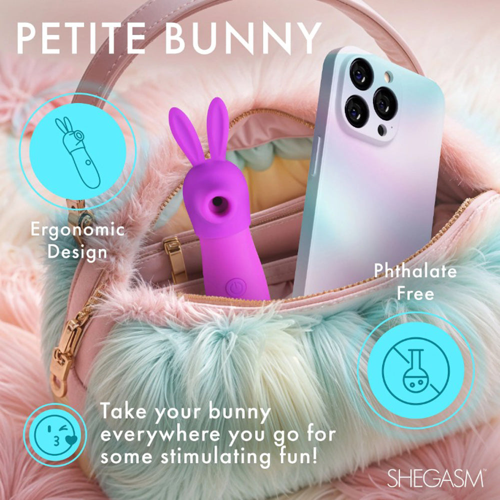 A purple bunny-shaped clitoral stimulator with a phone in a fuzzy bag.