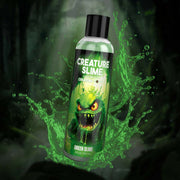 A bottle of green water-based lube with a creature graphic and the text "Creature Slime" and "Green Slime".