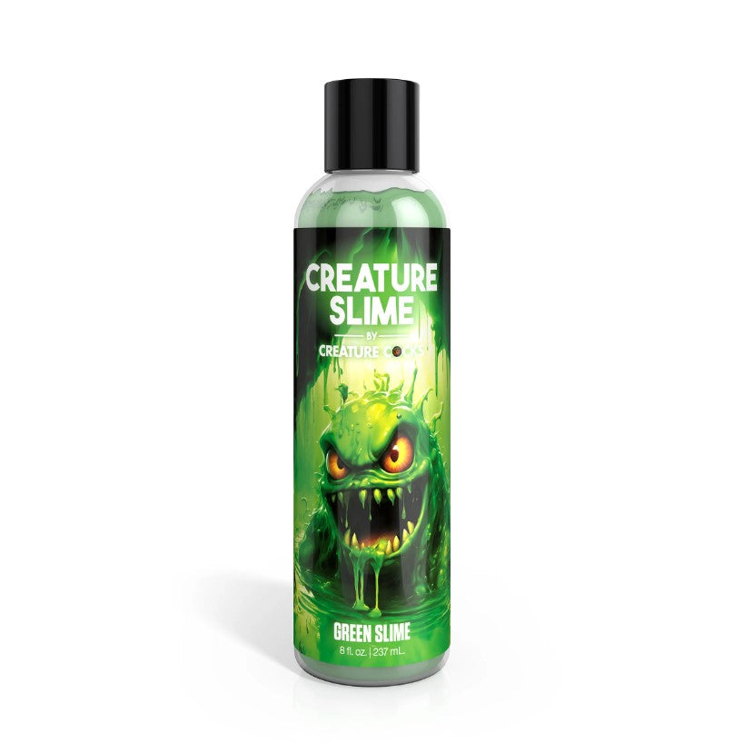 A bottle of green creature slime lube with a monster illustration.