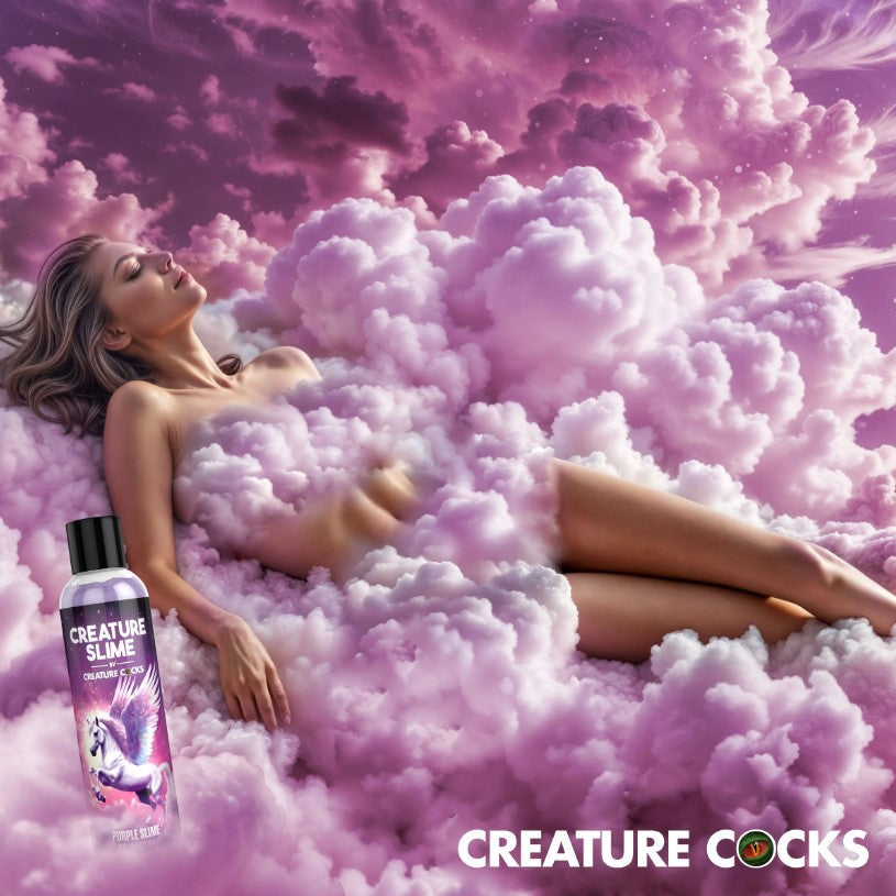 Purple water-based lube with a unicorn on the bottle, surrounded by pink clouds.