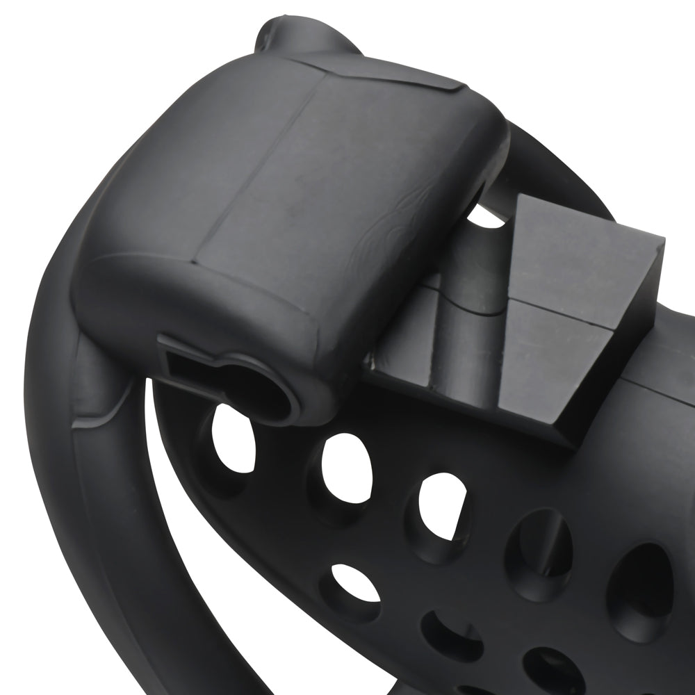 Black breathable chastity cage with a slotted design and a locking mechanism.