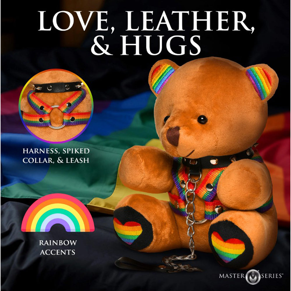 A teddy bear with rainbow accents, a spiked collar, and a harness.