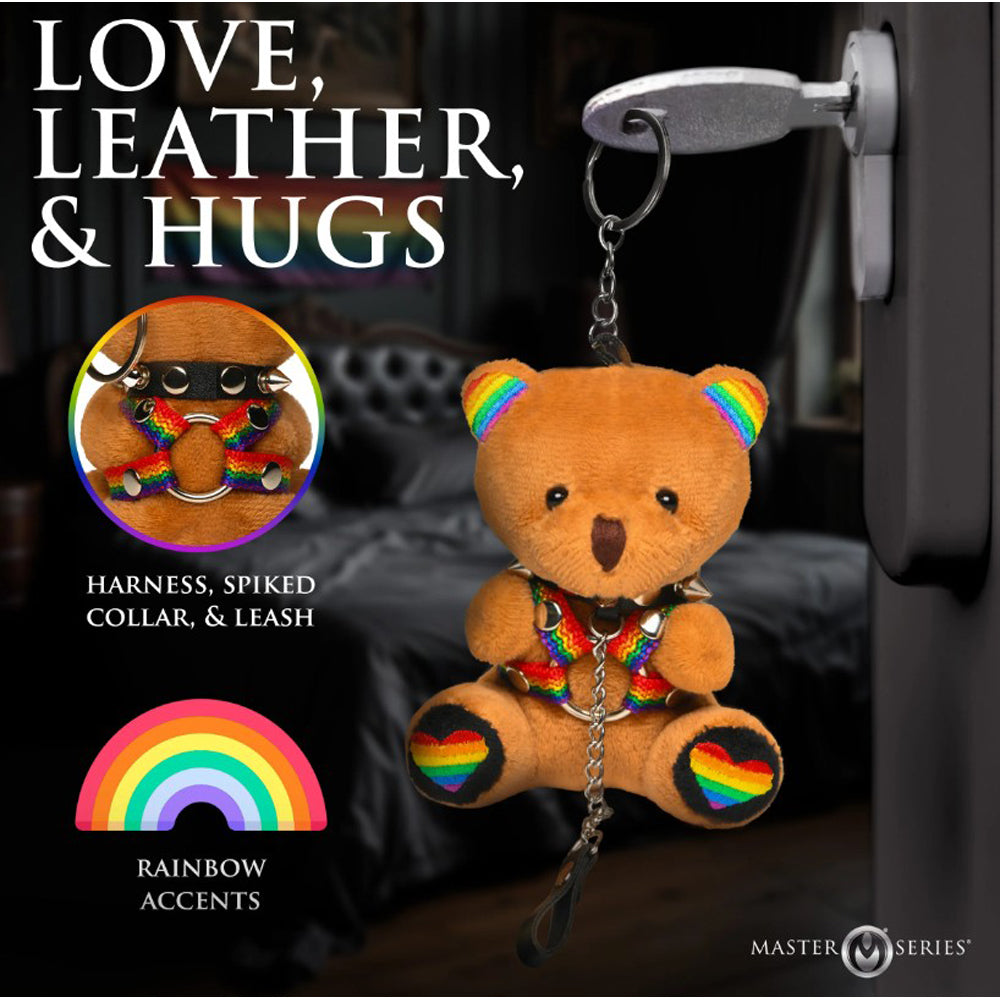 A plush teddy bear keychain with rainbow accents and a spiked collar.
