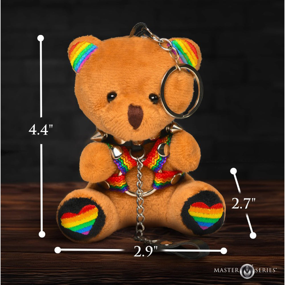 Pride teddy bear keychain with rainbow harness and spiked collar.