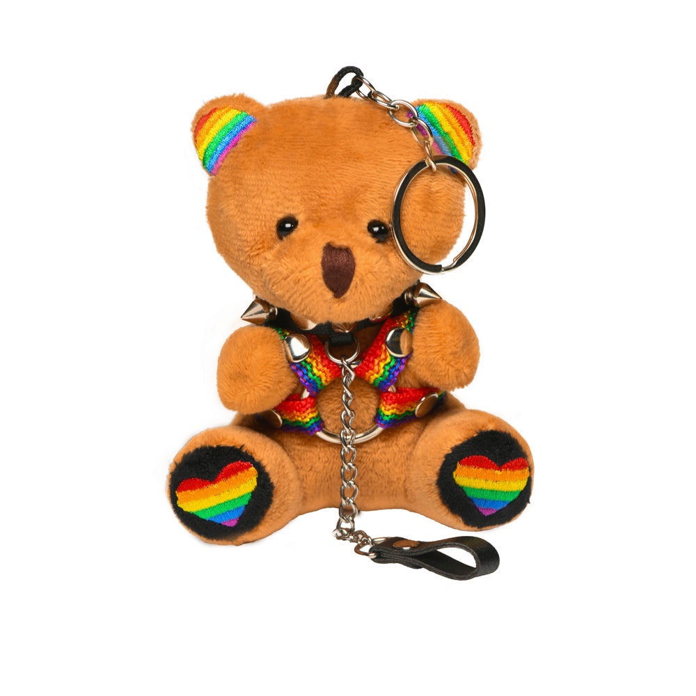 Pride teddy bear keychain with rainbow harness and spiked collar.