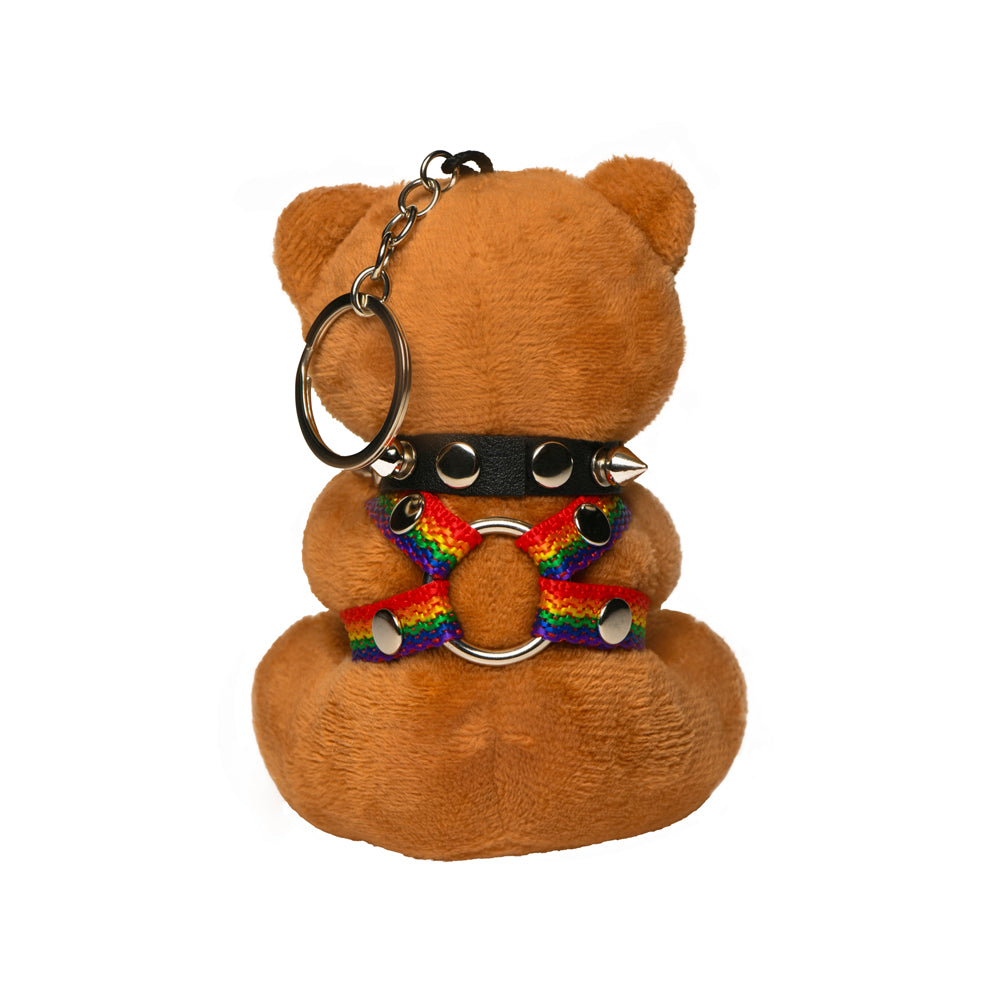 Pride teddy bear keychain with rainbow harness and spiked collar.