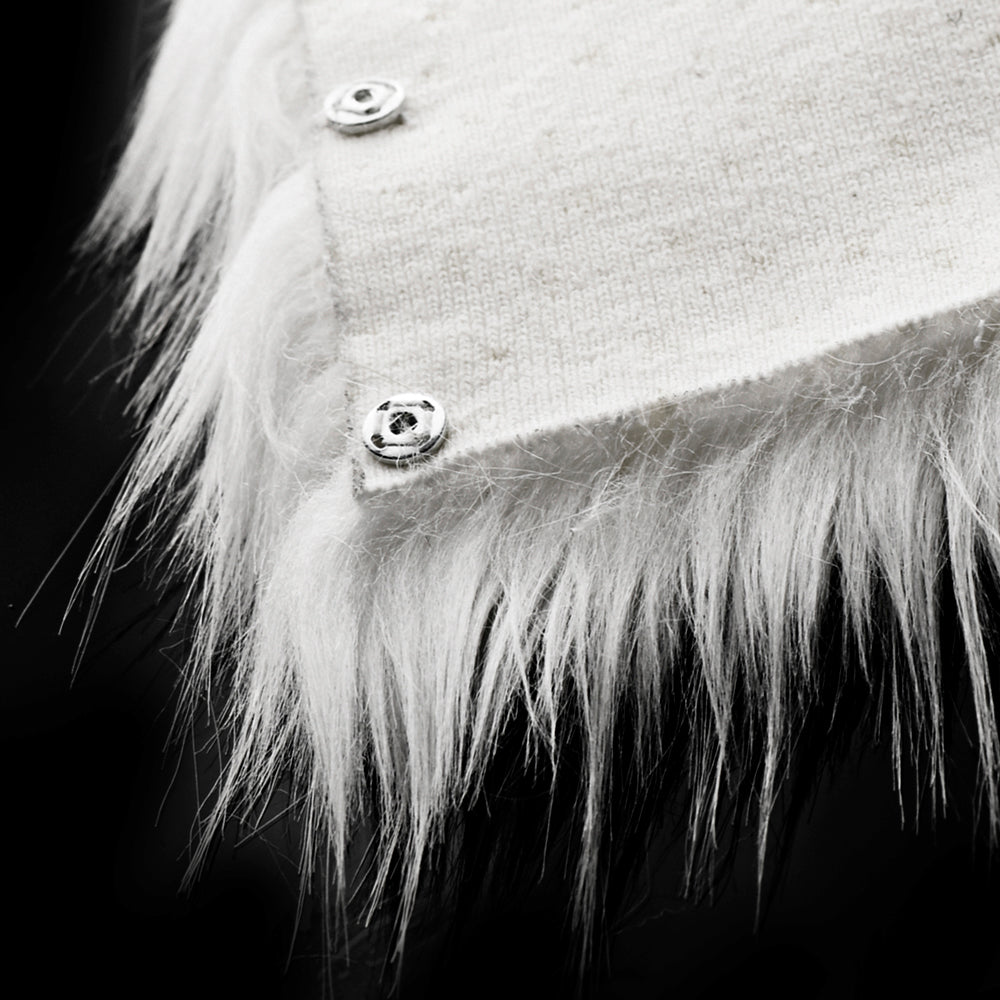 White fuzzy trim with two silver snap buttons on a textured fabric.