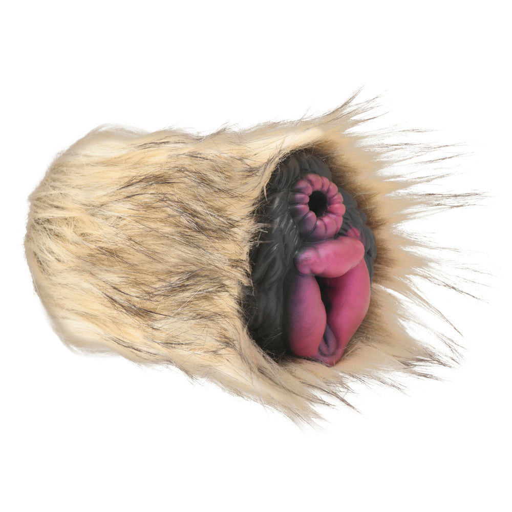 She-wolf stroker with washable fur and dual silicone tunnels.