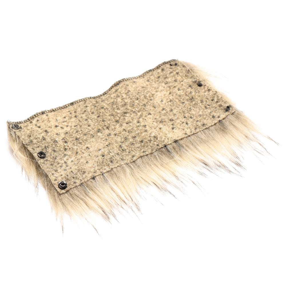 A beige and black speckled fabric band with faux fur trim and black snaps.