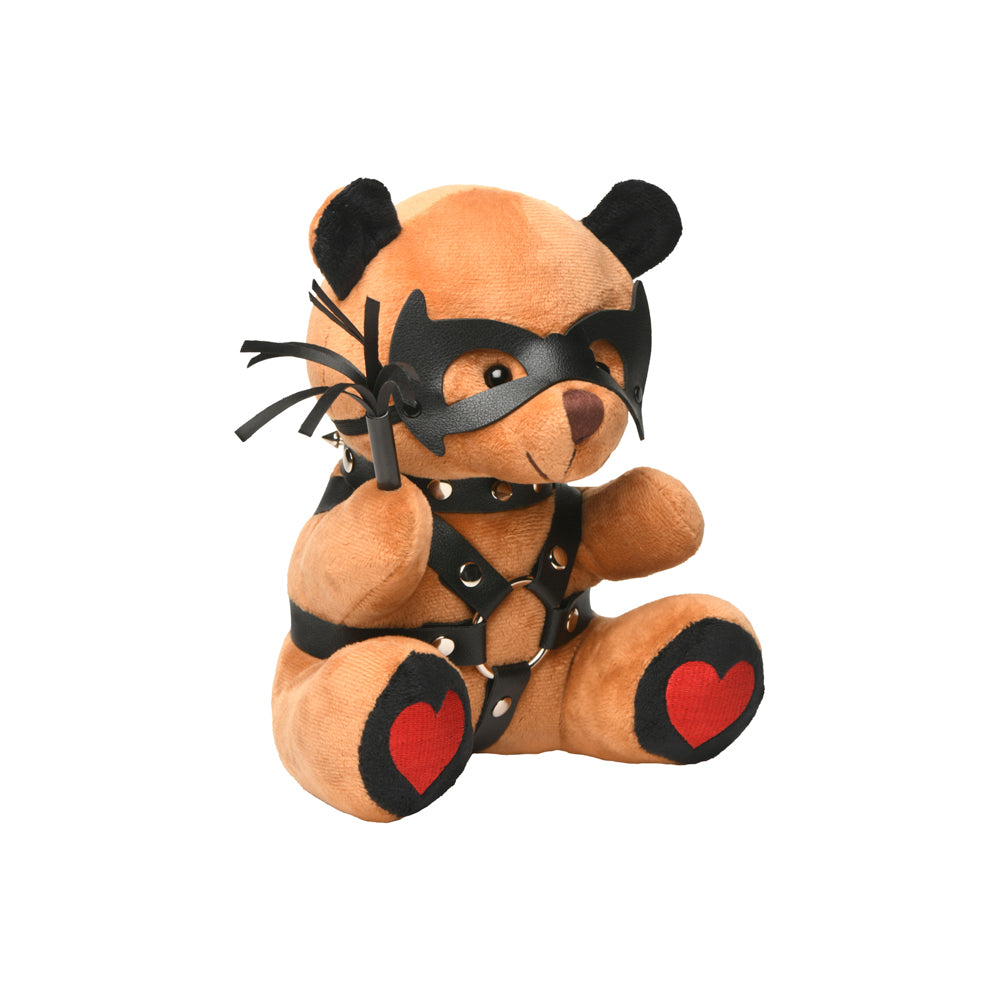 Brown teddy bear with black vegan leather mask, harness, and whip.