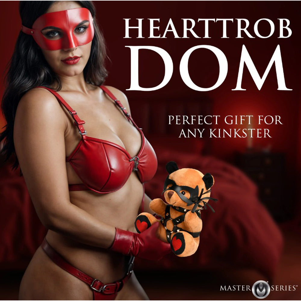 Plush teddy bear with vegan leather harness and mask details.