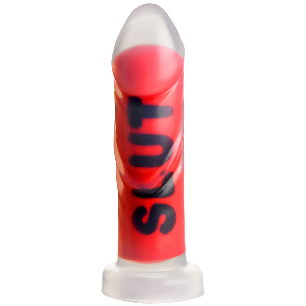 Red ribbed silicone dildo with clear tip and black lettering.