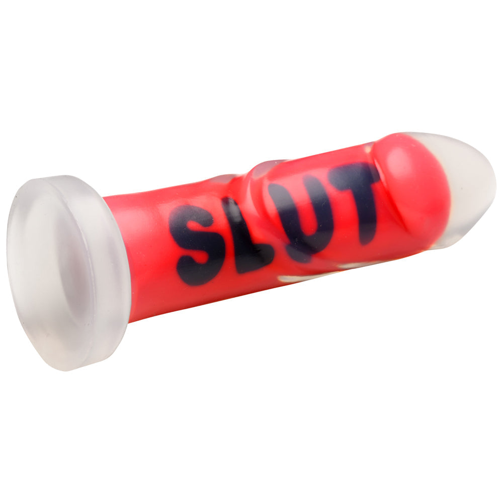 Red ribbed silicone dildo with clear suction cup base and black lettering.