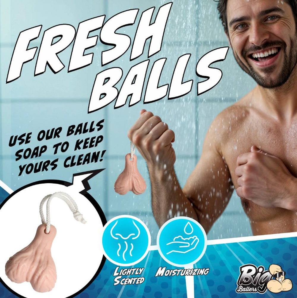 A novelty soap shaped like testicles hangs from a rope, with text promoting it as "Fresh Balls" soap.