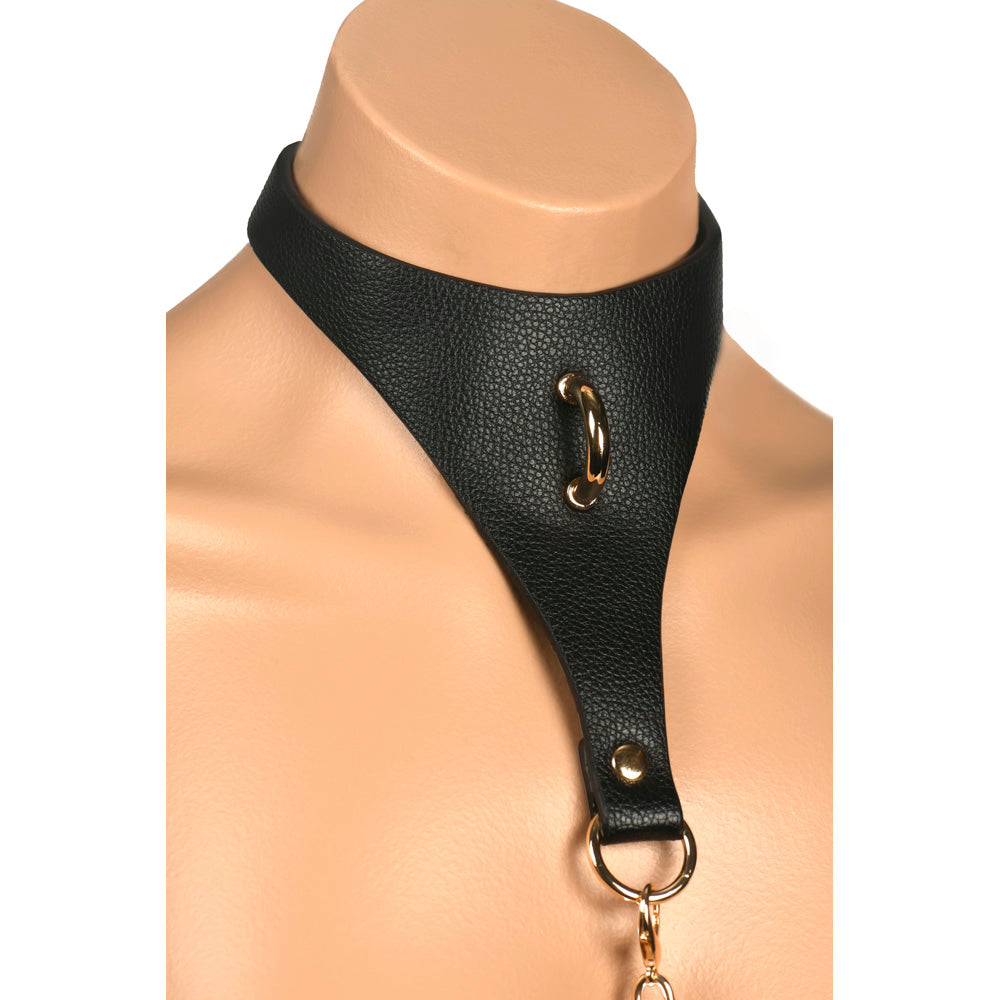 Vegan leather bondage collar with gold hardware on a mannequin.
