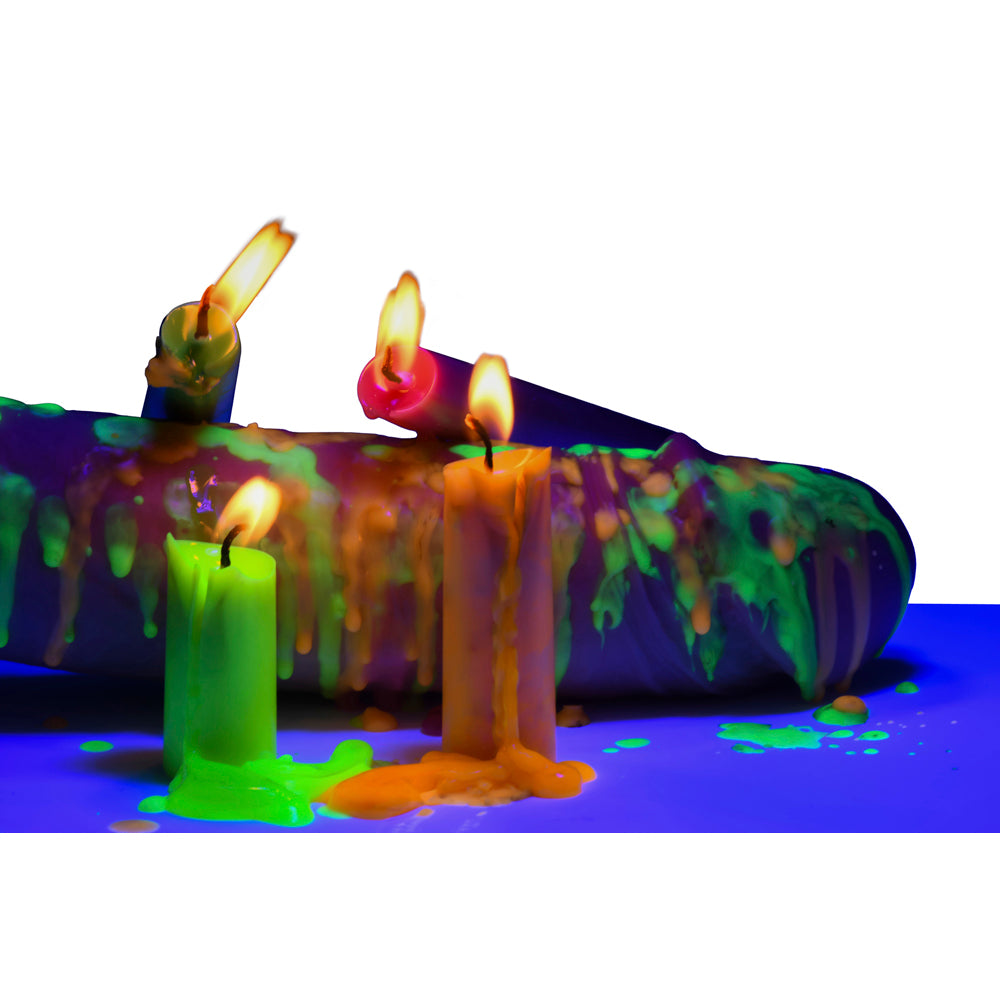 Four neon drip candles glow under blacklight, with wax melting down.