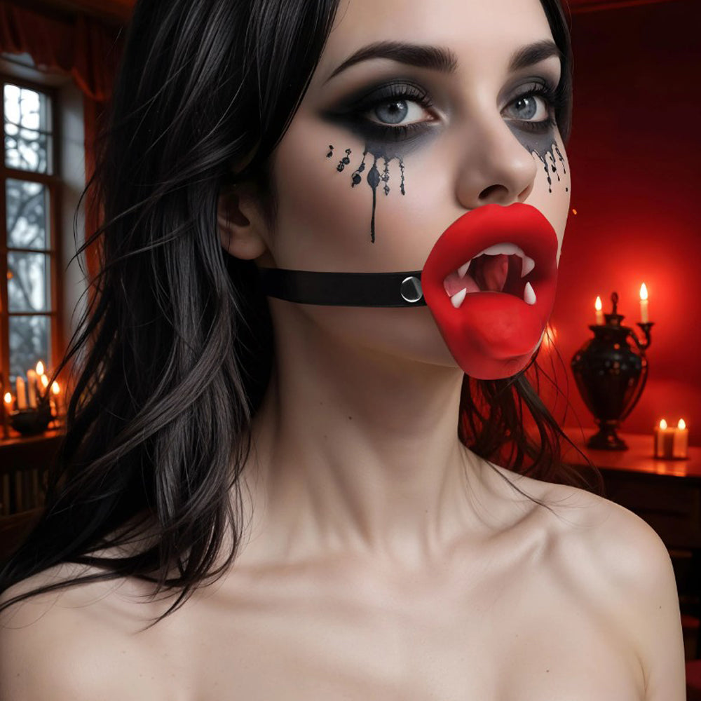 Vibrating vampire mouth gag with red lips and fangs on a black strap.