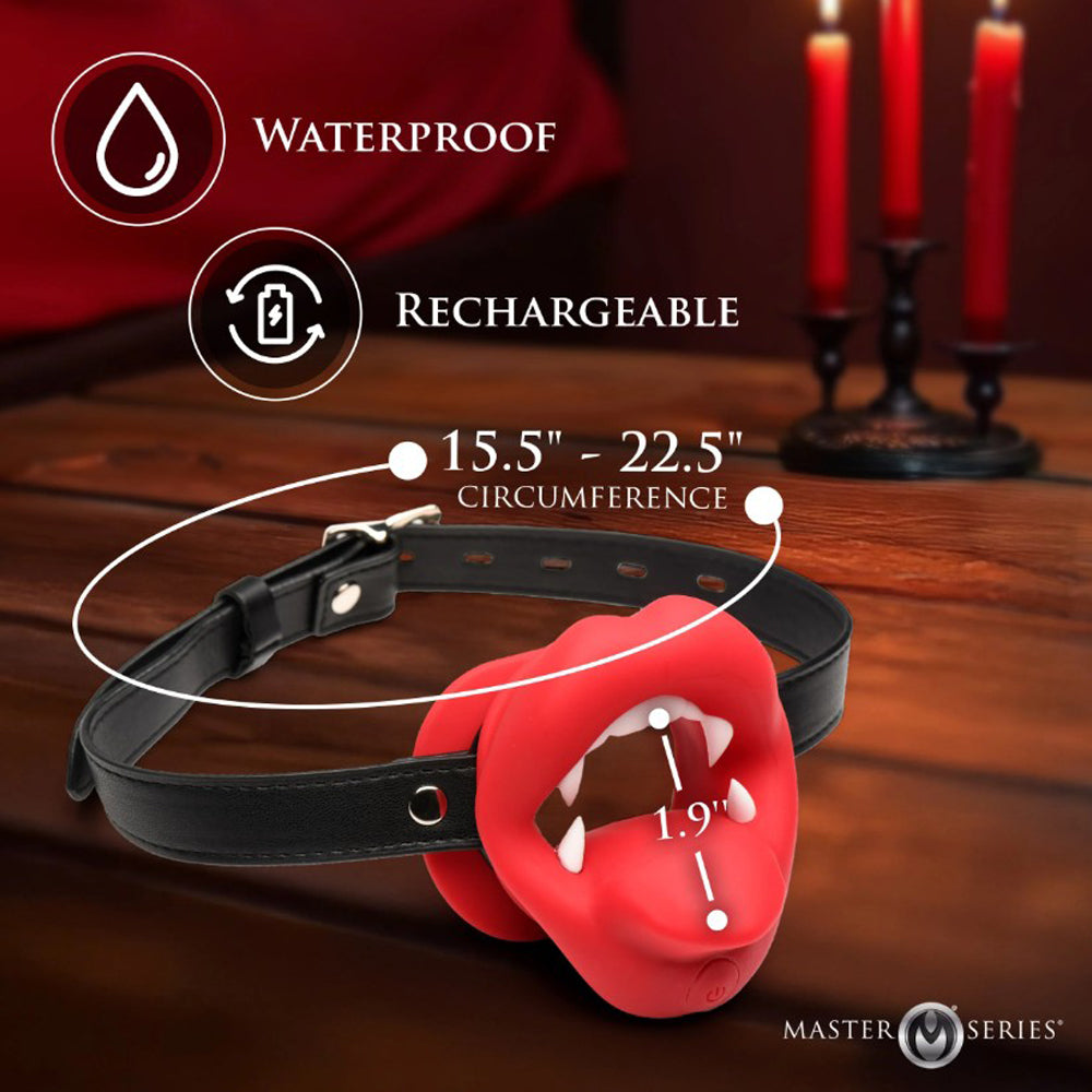 A red vampire mouth gag with fangs on a black adjustable strap, labeled waterproof and rechargeable.
