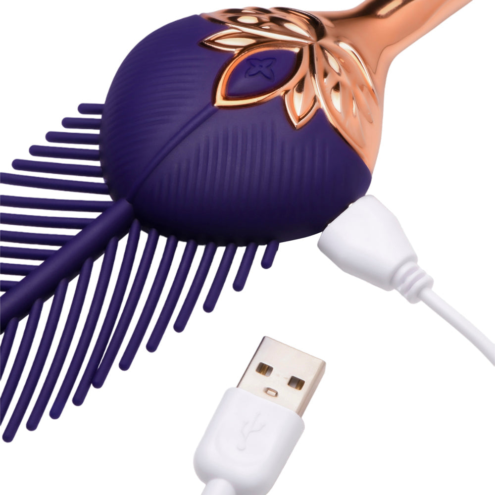 Purple silicone feather tickler with rose gold accents and USB charging cable.