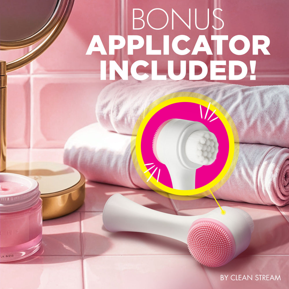 A white exfoliating facial cleansing brush with pink silicone bristles and a white brush head.
