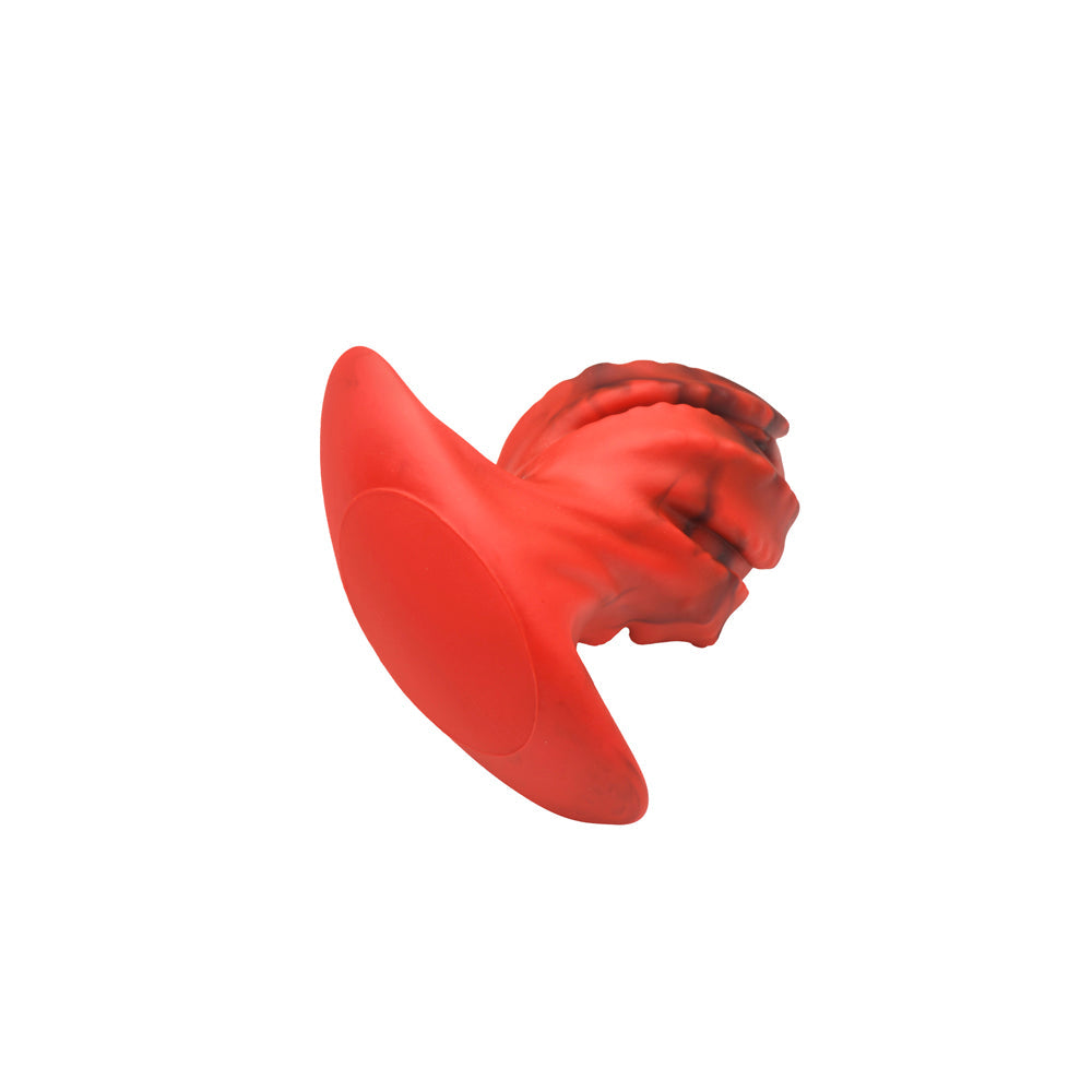 Red and black dragon egg shaped silicone butt plug with textured ridges.