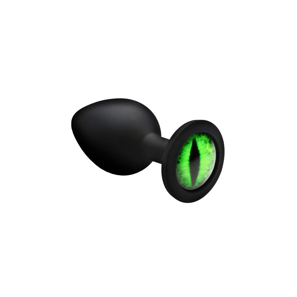 Black silicone anal plug with a green creature eye design.