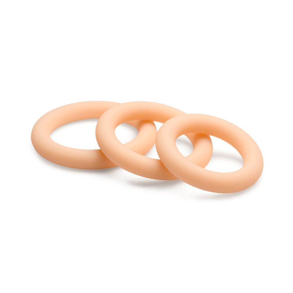 Three light-colored silicone rings of graduated sizes.