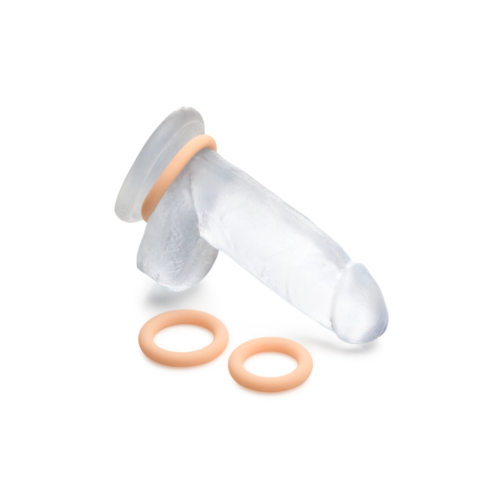Clear silicone cock ring set with three light-colored rings.