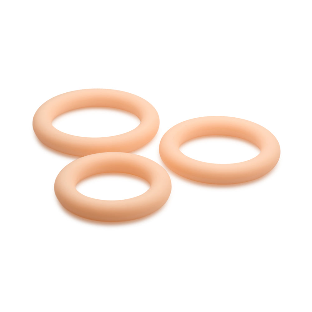 Three light-colored silicone rings of graduated sizes.