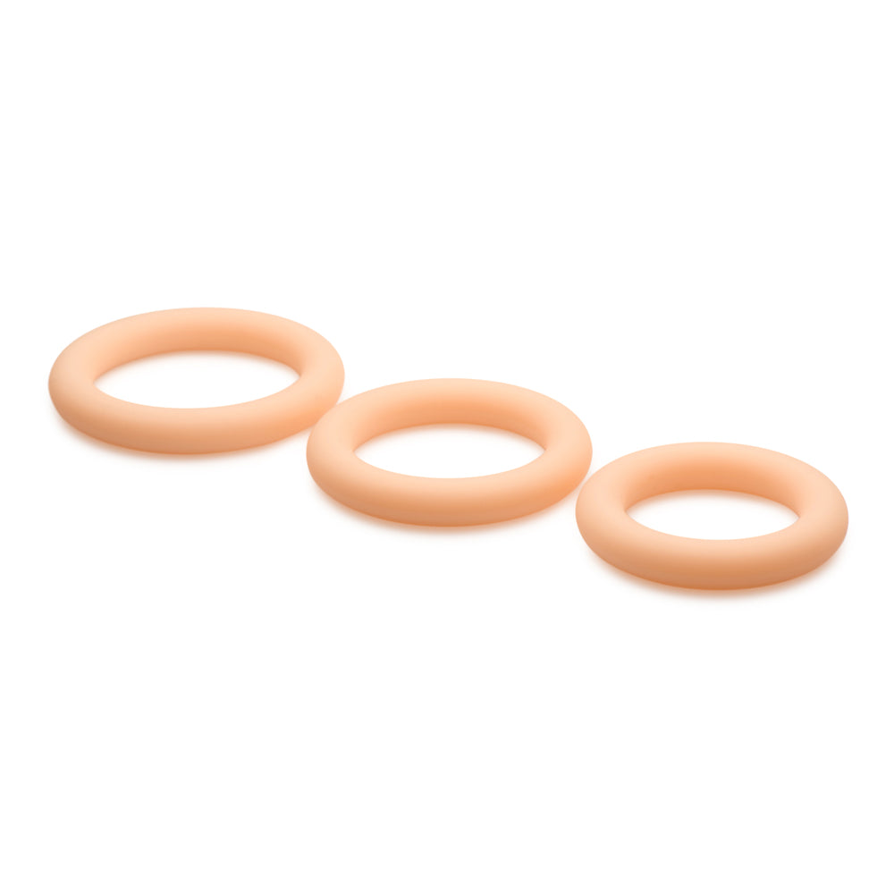 Three light-colored silicone rings of graduated sizes.