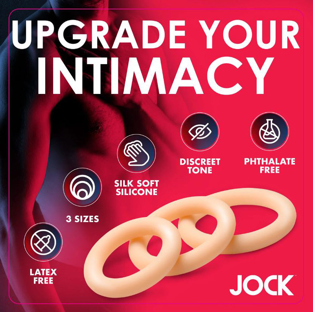 Three light-colored silicone cock rings in graduated sizes.