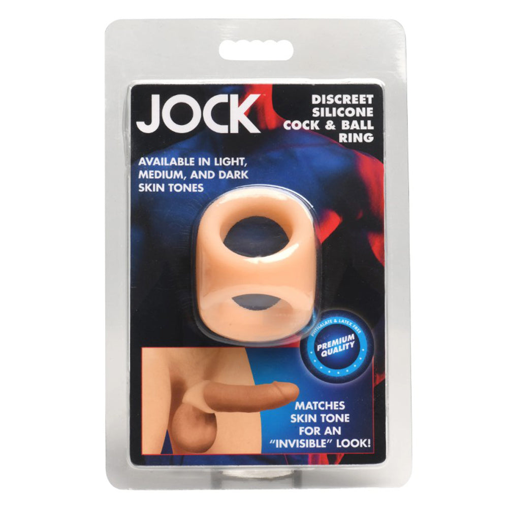 A light skin tone silicone cock and ball ring in its packaging.