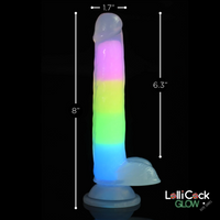 Rainbow silicone dildo with glow-in-the-dark feature and suction cup base.