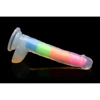 A 7-inch glow-in-the-dark rainbow silicone dildo with balls and suction cup base.