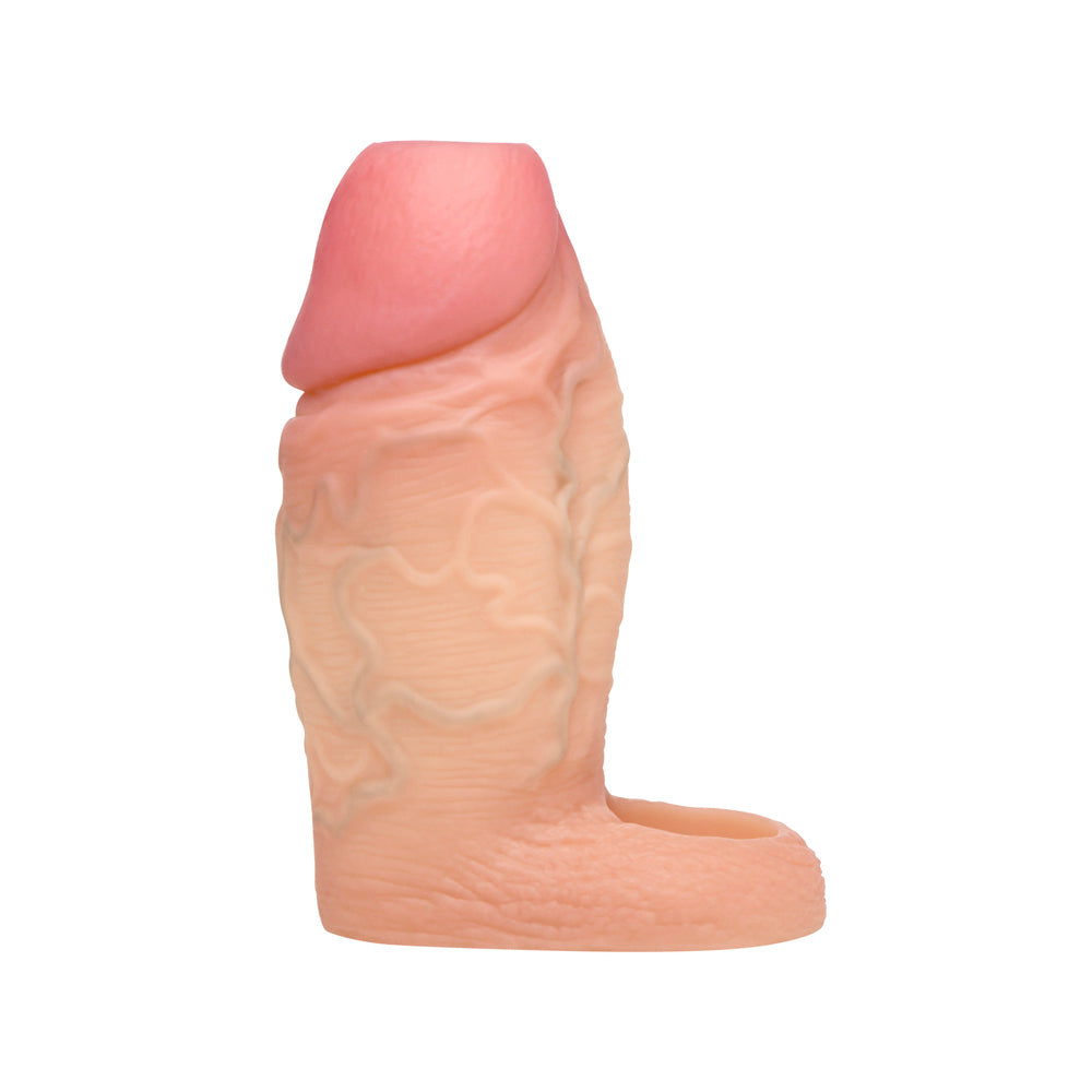 Light pink silicone penis extension sleeve with ball strap, shown from side view.