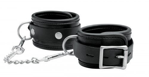 Black leather wrist cuffs with silver buckles and a connecting chain.